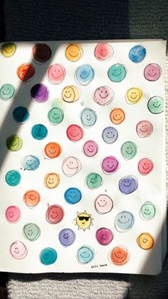 a white paper with colorful buttons on it