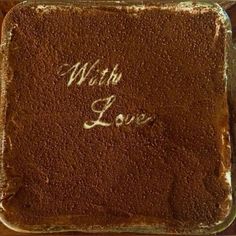 a chocolate cake with the words with love written on it