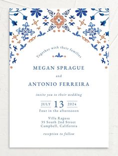 an ornate wedding card with blue and orange flowers