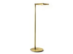 a gold floor lamp on a white background with the light turned off and dimming