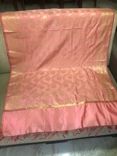 This is a beautiful Indian Banarasi style dupatta in the traditional Banarasi silk blend material. It is a lovely pink piece with heavy intricate work on both the top and the bottom of the dupatta and small intricate gold work throughout the piece.  This will pair well with your traditional Indian suit on an upcoming Indian themed party or occasion. You can also drape it around like a scarf on your western outfit. Perfect as a gift for the fashionista in your life! It measures about 90.6 inches Pink Salwar Kameez With Self Design For Celebration, Pink Dupatta With Cutdana For Party, Pink Salwar Kameez With Zari Work For Celebration, Pink Cutdana Dupatta For Party, Festive Pink Salwar Kameez For Celebrations, Pink Katan Silk Traditional Wear With Sheer Dupatta, Pink Traditional Wear With Dupatta In Art Silk, Festive Pink Katan Silk Salwar Kameez, Celebration Pink Salwar Kameez With Pallu