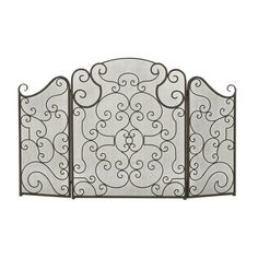 an iron fireplace screen with scroll designs on the top, and bottom part in black