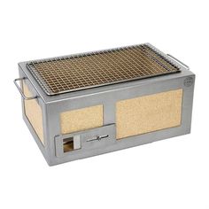 a large metal box with a grill on the top and bottom part in front of it