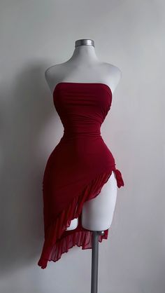 a mannequin with a red dress on display