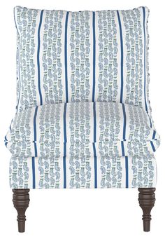 an upholstered chair with blue and white stripes