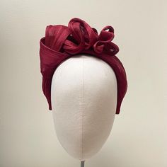 This stunning headpiece has been carefully made using millinery techniques to a high quality. The base band has been crafted with padding and the fabric has been hand stitched for longevity. With no glued elements this piece will set you apart from others in the marketplace.  Also has the option of a beautiful matched burgundy blusher veil fixed to a gold comb. SIZE & FIT: All of my headbands are made using a very flexible Alice band suitable for all head sizes. Unlike other headbands my beautiful fabrics are not glued to a visible,  covered or uncovered base band. They are carefully and sustainably made with the base band sewn into the headband with soft padding for extra structure, longevity and to all day comfort, without the band digging in.  PACKAGING Each headband is wrapped in prett Adjustable Sinamay Fascinator With Structured Crown, Elegant Sinamay Headband Fascinator, Formal Handmade Flowers Fascinator Headband, Formal Fascinator With Handmade Flowers, Formal Fascinator With Handmade Flowers On Headband, Formal Sinamay Fascinator, Fitted Sinamay Headpiece With Structured Crown, Elegant Adjustable Red Turban, Adjustable Sinamay Fascinator For Formal Occasions