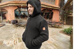 Introducing our premium woolen hoodie, a versatile and stylish essential for embracing the chill in utmost comfort and sophistication. This multifunctional piece seamlessly combines the coziness of a sweater, the elegance of a cardigan, and the warmth of a jacket, making it a must-have for both men and women. Crafted from the finest quality charcoal black wool, this hoodie exudes a timeless charm that effortlessly complements any winter wardrobe. The luxurious feel of the premium wool not only adds a touch of opulence but also ensures durability and longevity, promising a cherished addition to your cold-weather attire. Designed for the coldest of days, our hoodie features a thoughtful polar lining, providing an extra layer of insulation and protection against the harshest elements. Embrace Cold Weather Attire, Jacket Making, Jacket Sweater, Charcoal Black, Black Wool, Black Charcoal, Winter Wardrobe, Cold Day, Sweater Jacket