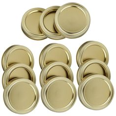 a bunch of gold colored metal plates on a white background