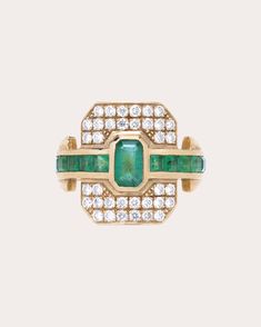 Modeled after traditional signet styles, this 18-karat gold ring features a recessed face detailed with pavé white diamonds and the brand's signature curved shape. An outward facing row of genuine emeralds—anchored in bezel and channel settings—creates an enviable pop of color. From Rainbow K’s Signature Collection, distinctive expressions of elegant individuality. 18k yellow gold, emerald and white diamond Carat: 0.3 ctw diamond, 1.2 ctw emerald Diamond color: F Diamond clarity: VS Diamond cut: Mens Diamond Jewelry, Gold Shield, Horn Bracelet, Pave Bangle, Shield Ring, Emerald Diamond Ring, Diamond Guide, Vs Diamond, Emerald Diamond