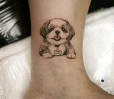 a small dog tattoo on the ankle