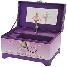 an open purple box with a ballerina figure in the top and bottom section on it