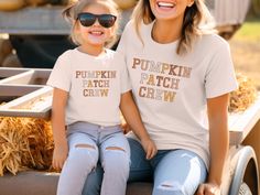 These super-soft, lightweight Pumpkin Patch Crew Shirts are perfect for fall days at the pumpkin patch and group family photos. Please check the size charts for the perfect fit! Details: ✔ Solid colors: 100% cotton. ✔ Heather colors: Cotton polyester blend. ✔ Lightweight fabric. ✔ Premium DTG prints - no peeling or cracking. ✔ Easy care: Machine washable, maintains shape and color. 🗓️ Current Production Time: 2-5 business days. All Marin Studios products are lovingly designed in my studio in Ma White T-shirt For Fall Family Matching, Family Matching Short Sleeve Tops For Fall, Fall Family Matching Crew Neck Tops, Casual Family T-shirt For Fall, Fall Tops With Letter Print, Family Letter Print Tops For Fall, Fun Custom Print Tops For Fall, Mommy And Me Shirts, Family Matching Shirts