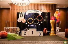 an olympic themed party with balloons and decorations