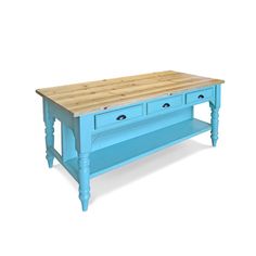 a blue kitchen island with two drawers on one side and a butcher block top on the other