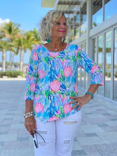 92% Nylon / 8% Spandex. Cathy is 5'6 and wearing a size medium Stretch knit top. Scoop neckline. 3/4 sleeve. Asymmetrical hemline. UPF 50 sun protection. Pre-shrunk. Center back length: 25 inches. Machine wash. Imported. Online and in stores. Style Number: SPX0639 CRMC Seashell Beach, Asymmetric Top, Cruise Wear, Line Shopping, Asymmetrical Tops, Designer Jeans, Caicos Islands, Guinea Bissau, Mozambique