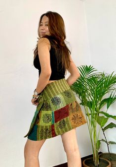 Introducing the Groovy Soul Mini Wrap Skirt, a vibrant and versatile addition to your wardrobe. This eye-catching piece showcases intricate patchwork designs that blend traditional block prints with modern flair, creating a one-of-a-kind look. Crafted from soft, breathable cotton and lined with plain cotton inside, it offers comfort and style for any occasion. The wrap-around style, secured with a double line of popper buttons at the waist, ensures a customizable fit. Whether you dress it up wit Mini Wrap Skirt, Mini Wrap, Patchwork Designs, Pitcairn Islands, British Indian, Wrap Skirt, Brunei, Skirt, Wardrobe