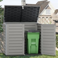 an outdoor storage shed with a green trash can