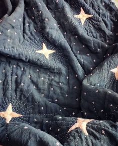 an unmade quilt with stars on it