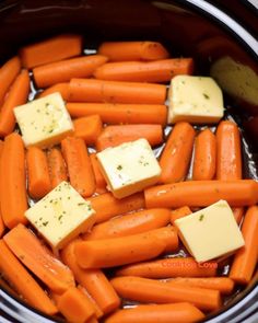 carrots and cheese are being cooked in the slow cooker