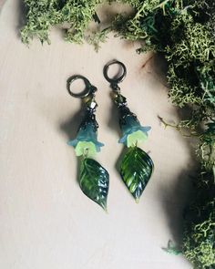 Moss Fairy Earrings, Moss Green Flower Earrings, Moss Green Lucite Flower Earrings, Moss Faerie Earrings, Art Nouveau Earrings Do you want to feel like a moss fairy? Here is an enchanting pair of green flower earrings with vintage green glass leaves inspired by my love of moss! You will find many shades of green in these earrings! I made these mossy green earrings using: *two different shades and sizes of green Lucite flowers (dark green and light green) *antiqued brass leaf beadcaps *sparkly ol Moss Fairy, Indian Inspired Jewelry, Nouveau Earrings, Green Flower Earrings, Art Nouveau Earrings, Lucite Flower Earrings, Fairy Earrings, Flowers Dark, Art Nouveau Earring