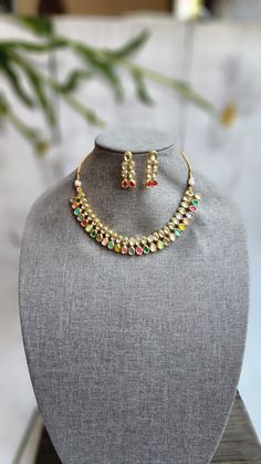 Very Gorgeous and elegant stone choker in antique gold with matching earrings Versatile. Can be paired with number of outfits.Perfect to wear at weddings occasions. Festive Kundan Choker With Hand Set Details, Festive Kundan Hand Set Choker, Gold-plated Hand Set Kundan Necklace For Celebrations, Hand Set Gold Plated Kundan Necklace For Celebration, Gold Kundan Necklace With Matching Earrings, Hand Set Kundan Choker Necklace, Festive Gold Plated Kundan Choker Necklace, Festive Gold-plated Kundan Choker Necklace, Gold Kundan Necklace With Matching Earrings For Diwali