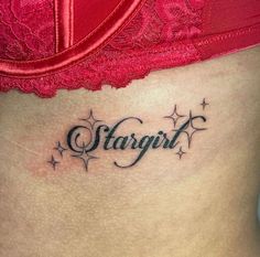 a woman's stomach with the word stargirl written in cursive font