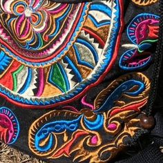 This Colorful Bohemian Backpack was handcrafted by talented artisans using a stunning fabric embroidered by the Hmong Hill Tribes in Northern Thailand. Lightweight and durable, this unique and gorgeous Boho Bag is perfect to pack your essentials wherever you go. Details: Embroidered cotton fabric and cotton linning. Expandable shoulder Straps Drawstring and zipper top closure with little pom poms decoration. Magnetic closure cover Interior zipper pocket Overall dimensions (approximate): Boby: 13 Bohemian Backpack, Boho Backpack, Embroidered Backpack, Colorful Bohemian, Bohemian Colors, Northern Thailand, Blue Backpack, Boho Bag, Zipper Top