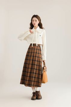 Pleated plaid midi skirt in cozy colors to go with your autumnal fits. Features an elastic waist back. Lined. One Size: 26"-36" waist, 31" length Casual Plaid Skirt For Fall, Casual Plaid Skirt For Work, Fall Plaid Long Skirt, Fall Plaid Relaxed Fit Skirt, Plaid Long Skirt For Fall, Long Plaid Skirt For Fall, Fall Plaid Pleated Flared Skirt, Plaid Skirt For Fall Workwear, Plaid Skirt For Work In Fall