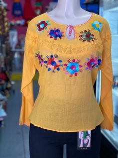 Great customer is our priority We're Friendly and Helpful Check our feedbacks We are listing a Brand New never been Used100% Authentic Mexican Dress                                This Blouse is gorgeous. 100% Authentic Mexican Shirt This Shirt is gorgeous. Color:yellow  Size:M/L Chest: 23 Waist: 23" Sholder:23" Sholder to hem:26" Ebroidery Mexican shirt Please take a good look an the picture to see if this is the color your looking for. Folk Fabric Flowers Mexican Tunic Traditional Embroidery T Bohemian Yellow Tops With Floral Embroidery, Yellow Bohemian Tops With Floral Embroidery, Yellow Long Sleeve Tops With Floral Embroidery, Yellow Embroidered Cotton Shirt, Spring Yellow Blouse With Floral Embroidery, Yellow Floral Embroidered Blouse For Spring, Yellow Bohemian Long Sleeve Peasant Top, Yellow Blouse With Floral Embroidery For Spring, Bohemian Yellow Long Sleeve Peasant Top