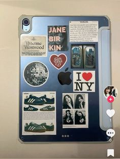 the back of an ipad with stickers and pictures on it's display case