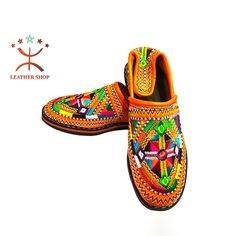 Special Offer: Buy 2 Slippers and Get 20% OFF.  Discount applies automatically at checkout. 🎉Berber Morocco Slippers, Embroidered Moroccan Babouche, Amazigh Leather Loafers, Women Goatskin Mules, Durable Sheepskin Mules💞 Berber leather slippers for women handcrafted in a small family workshop in Marrakech and Trafraoute, Morocco. This ethnic slipper from Tafraoute is undoubtedly one of the most original with its small colorful pompoms and delicate embroidery. This rare model was only created in Tafraoute, a small mountainous town in the Anti-Atlas, located 180 km south of Agadir. The high heel tongue is typical of slippers from this hilly region. Originally, it provides better support for the feet and protects the Achilles tendon when hiking in the mountains. these slippers are made enti Traditional Brown Hand-stitched Moccasins, Traditional Handmade Slippers With Round Toe, Traditional Brown Moccasins For Festival, Traditional Leather Loafers, Artisan Handmade Leather Slippers, Traditional Leather Slippers With Rubber Sole, Traditional Brown Leather Slippers, Traditional Slip-on Slippers With Rubber Sole, Traditional Slip-on Slippers With Leather Sole