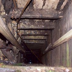 the inside of an old, run down tunnel