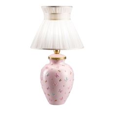 a pink ceramic lamp with a white shade