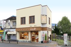 a small store on the corner of a street