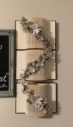 two books are decorated with paper flowers