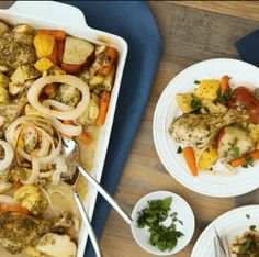 a casserole dish with chicken, onions, carrots and other food items