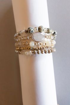 The Alice Beaded Bracelet Stack is a beautiful and versatile accessory that adds a touch of bohemian flair to any outfit. Each bracelet is made with gold pisa beads, natural stone beads and sparkling crystals, adding a touch of elegance to the natural, earthy vibe of the design. Available in four different colors, this bracelet stack is perfect for layering and can be worn with casual or formal attire. Whether you're heading to a festival, a night out with friends, or just adding some personalit Beaded Bracelet Stack, Boho Bracelets Stack, Layering Bracelets, Boho Layering, Natural Stone Beads, Layered Bracelets, Strand Bracelet, Formal Attire, Sparkling Crystal