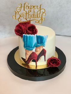 a birthday cake decorated with high heels and roses