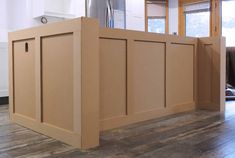 an unfinished kitchen island in the middle of a room