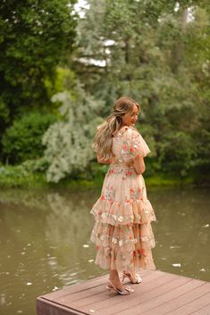 Step into a fairytale with the Garden Party Dress, where enchanting tan, pink, and green tulle layers weave a storybook dream. The sweetheart neckline and delicate flutter sleeves with charming bows make you feel like a princess, while the ruffle-tiered ankle-length skirt is perfect for twirling at any magical gathering. This dress if fit for a queen! fairytale dress, gown dresses elegant, garden party, garden dress, mommy & me dress, princess aesthetic Cottagecore Fairy Dress With Ruffles For Garden Party, Cottagecore Fairy Dress For Spring Garden Party, Spring Fairy Dress With Ruffles For Garden Party, Spring Cottagecore Fairy Dress For Garden Party, Fairycore Short Sleeve Dress For Garden Party, Tulle Fairy Dress For Spring Garden Party, Spring Tulle Fairy Dress For Garden Party, Whimsical Fairy Dress With Ruffles For Garden Party, Whimsical Ruffled Fairy Dress For Garden Party