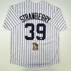 This is a custom jersey and was not manufactured by or in any manner associated with any professional sports league or manufacturer. This custom jersey carries no professional sports league designation. The item is intended to be an autographed collectible. Reference of team in the title is to allow the purchaser a point of association. The custom jersey displays the name, number and authenticated signature of the player. This item in no way is affiliated with or connected to any professional sports organization. The autograph, as always is guaranteed to be authentic and has been certified as authentic by a third-party, trusted authenticator. Size is XL unless otherwise noted. Cheap Striped Baseball Jersey With Collar, Affordable Short Sleeve Varsity Baseball Jersey, Jersey Display, Sports Organization, The Player, Custom Jerseys, Blue Check, Baseball Jersey, Third Party