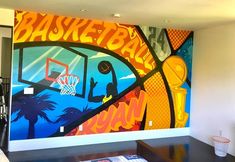 a basketball mural on the wall in a living room