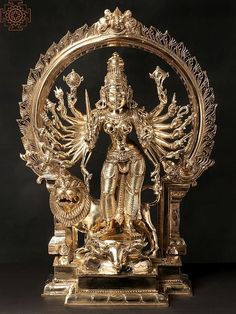 a golden statue with an intricate design on it