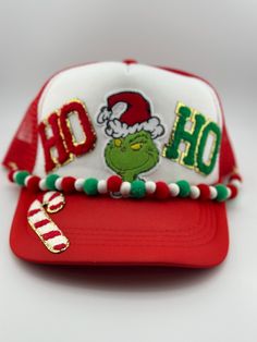 a red and white hat with the word ho ho on it