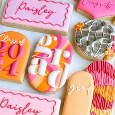 cookies decorated with different colors and designs on a table