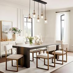 an elegant dining room with white chairs and large table