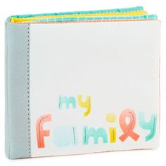 a white binder with the words my family printed in multicolored letters on it