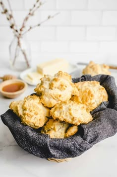 a bowl filled with biscuits on top of a table