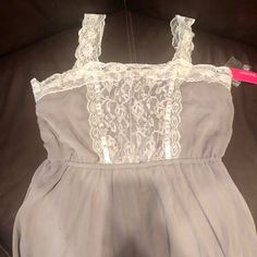 Gray And White Lace Sundress (Can Also Be Used As A Bathing Suit Cover) Chiffon Like Material (Polyester) Lace Straps Are Adjustable. This Is Brand New With Tags And Comes With Extra Button Replacement. Size Large. Comes To The Knee Or Just Above The Knee If Taller. White Lace Sundress, Lace Sundress, Grey Lace, Bathing Suit Cover, Bathing Suit Covers, Lace Straps, Gray Dress, Above The Knee, Bathing Suit