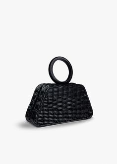 The intricate weaving technique and luxurious satin bracelet top handle give this bag a distinct texture and unique artisanal charm. Handwoven wicker body. Features ahidden magnetic closure. Measures 9.5” W x 5"H x 2.75" D with a 4” Handle Drop. Evening Rectangular Straw Bag With Bamboo Handle, Rectangular Straw Bag With Bamboo Handle For Evening, Luxury Handwoven Straw Bag With Top Handle, Luxury Handwoven Top Handle Straw Bag, Luxury Evening Straw Bag With Bamboo Handle, Black Straw Bag With Detachable Handle, Elegant Straw Bag With Woven Leather And Round Handle, Elegant Top Handle Handwoven Bag, Elegant Handwoven Top Handle Bag